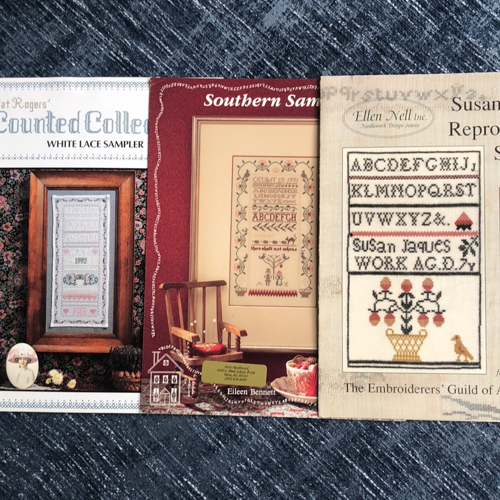 Collection of three cross stitch band sampler booklets